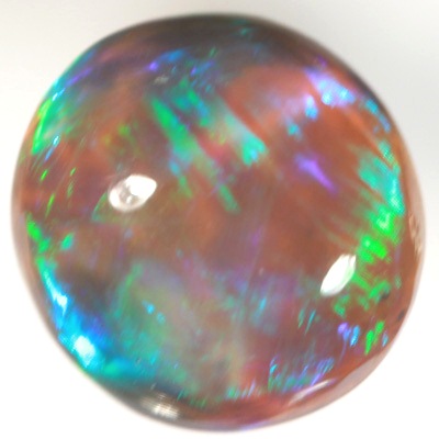 SOLID BLACK CRYSTAL OPAL Rolling flashes of green over purple fire